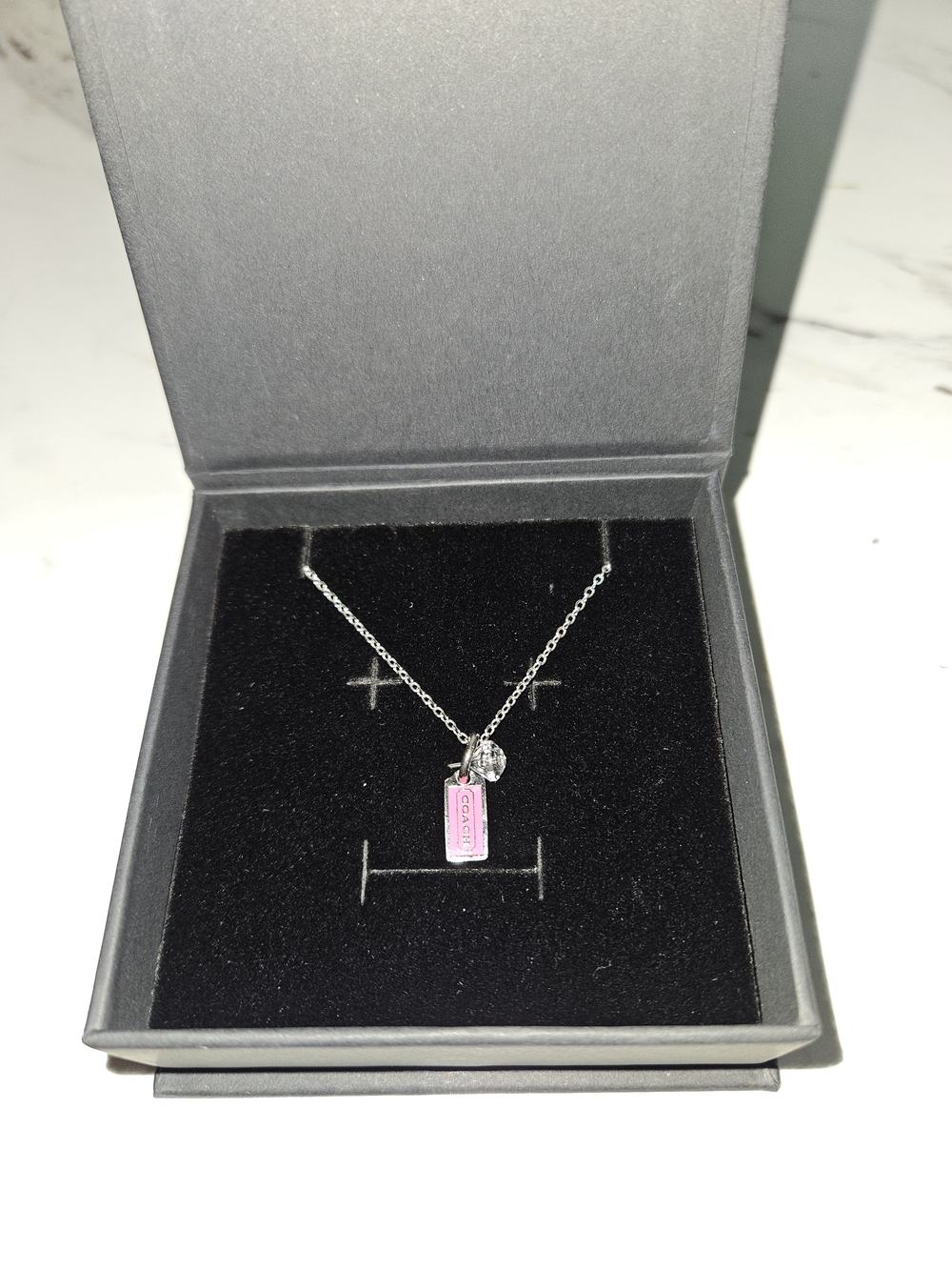 Coach Silver Necklace with Pink Tag Pendant and Clear Crystal Charm